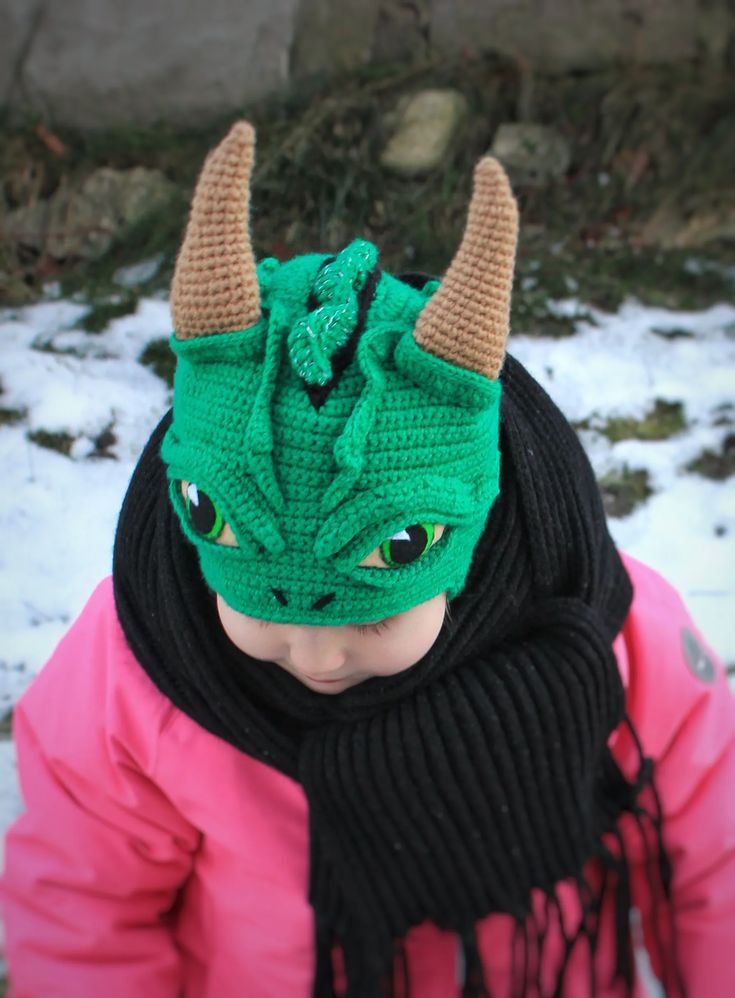 Introducing our incredible crochet dragon hat! This unique and eye-catching accessory is perfect for celebrating the new 2023 Year of the Dragon or adding a touch of fantasy to your Halloween costume. Crafted with meticulous attention to detail, this hat features amazingly expressive eyes that bring the dragon to life. The realistic crests and horns add an extra level of authenticity, making it a standout piece. Crochet Dragon Hat, Dragon Hat, Dragon Hats, 2023 Year, Fantasy Life, Expressive Eyes, Crochet Dragon, New 2023, Sewing Book