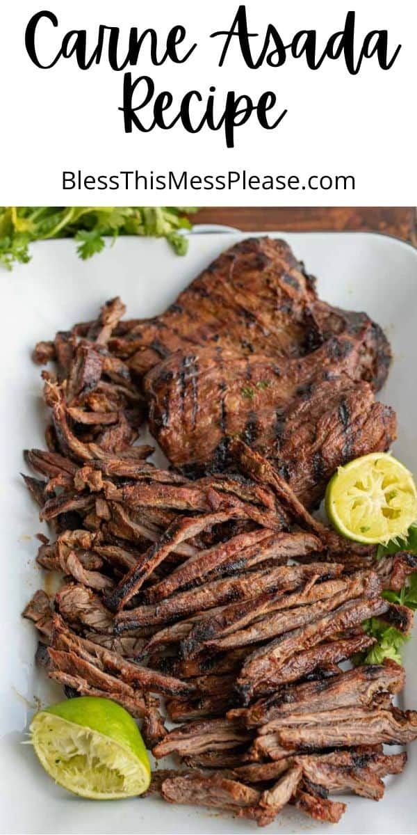 grilled steak on a white plate with lime wedges