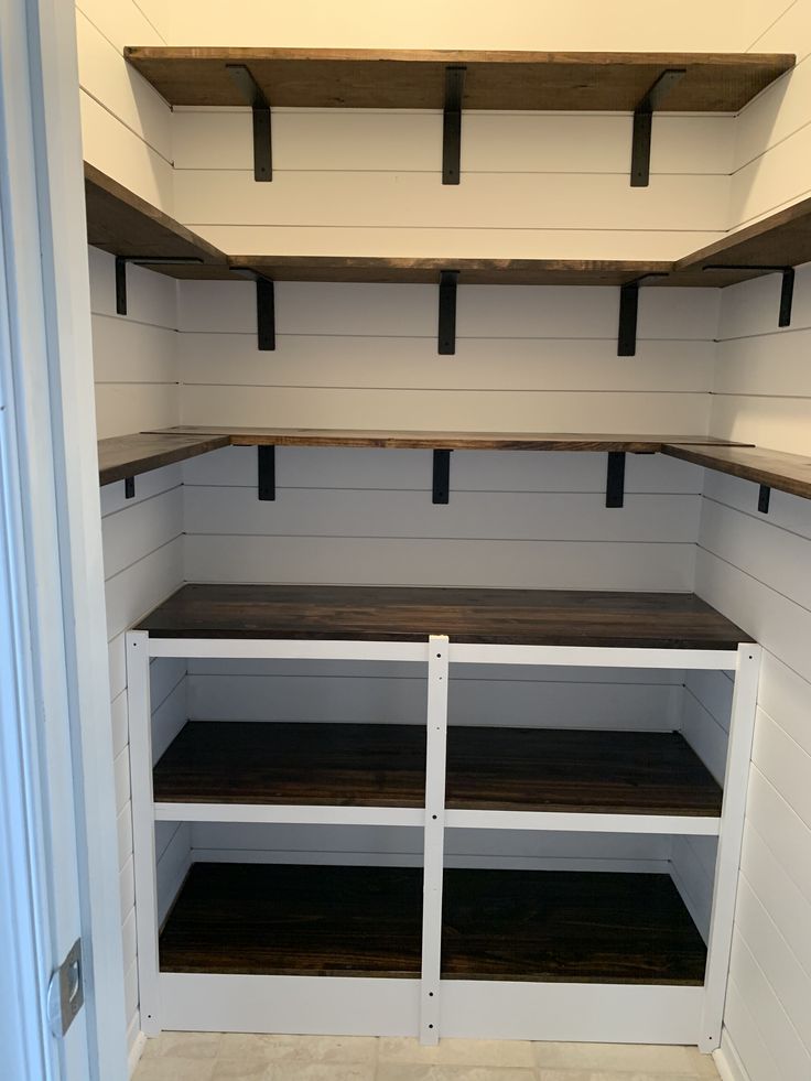 empty shelves in the corner of a room