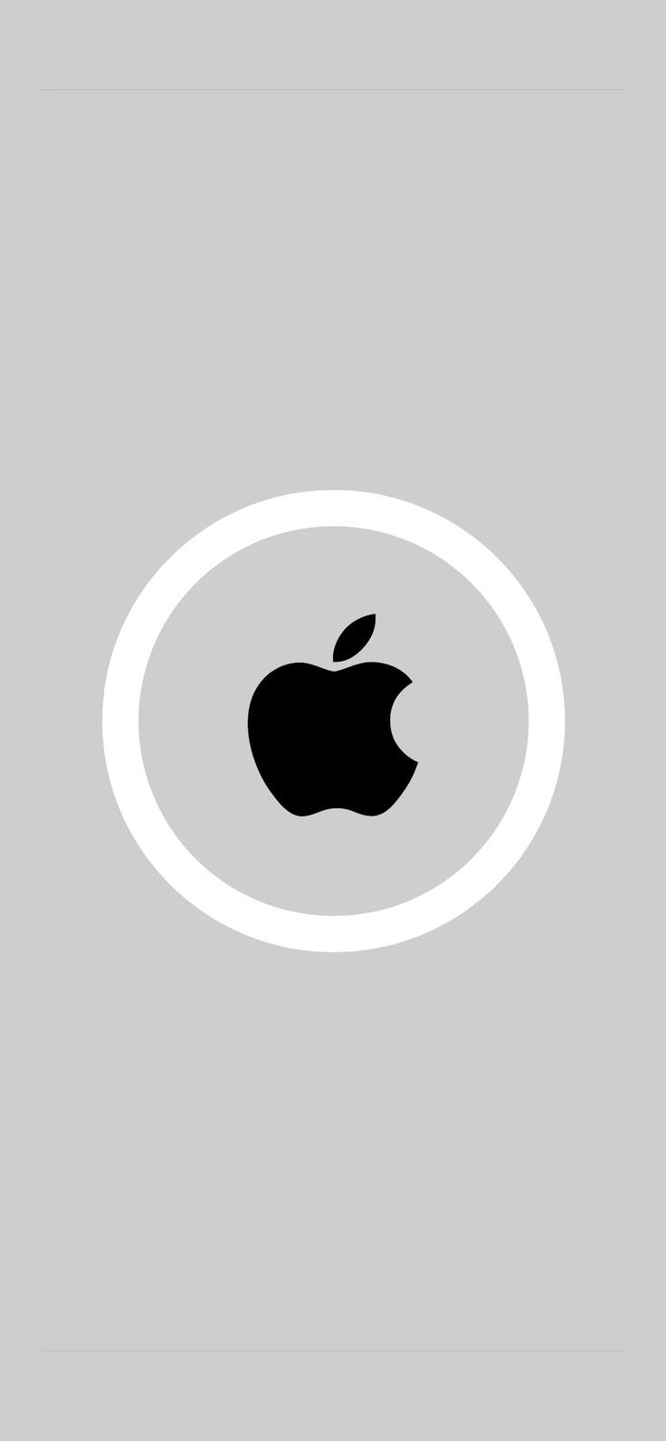 an apple logo is shown in the middle of a gray and white circle on a grey background