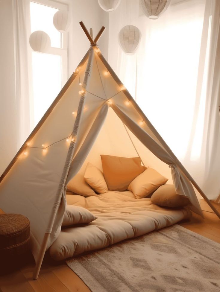 a teepee bed with lights on it in a room