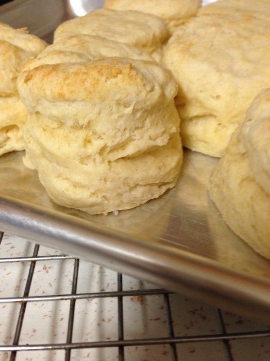 some biscuits are cooling on a rack in the oven and they are ready to be baked