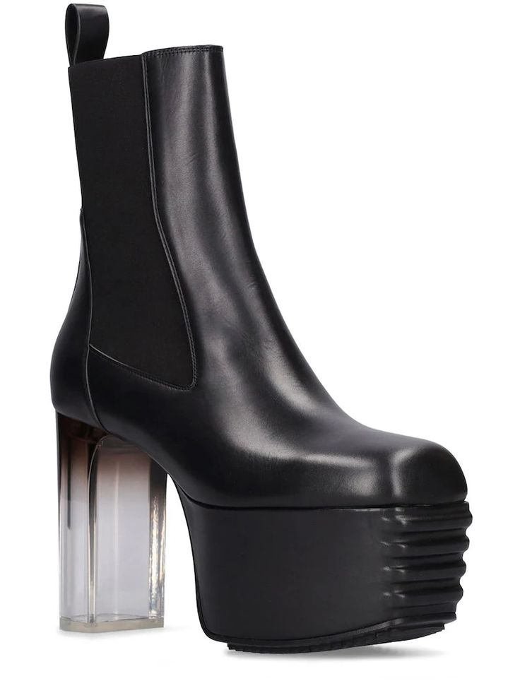 Rick Owens Kiss Boots Designer's ID: RU01C4829 Coming of the SS23 EDFU Collection, featuring a grilled platform, elastic panels on both sides with an integrated pull back and a grilled designed front, and a Thermoplastic heel. Color: Black Composition: Leather Made in ITALY Rick Owens Kiss Boots, Kiss Boots, Transparent Heels, Tabi Shoes, Black Heel Boots, Chunky High Heels, Womens Wedges, Designer Boots, Heel Boots