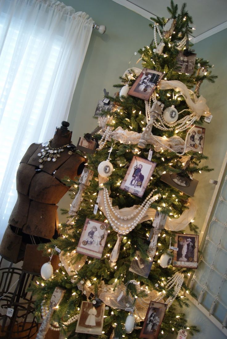 a decorated christmas tree with pictures on it