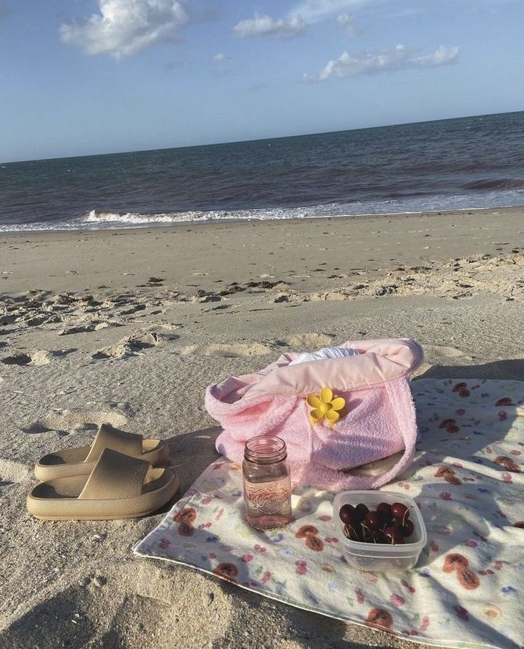 a towel and some food on the beach