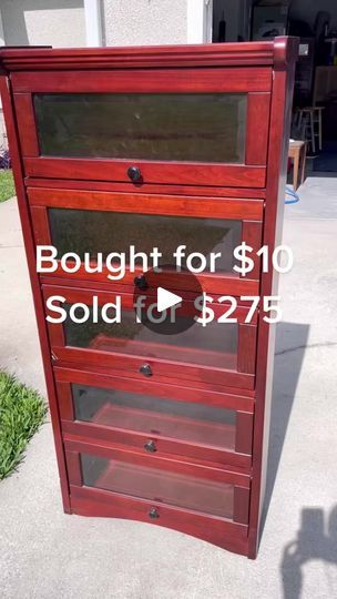 a red wooden cabinet with glass doors for $ 10