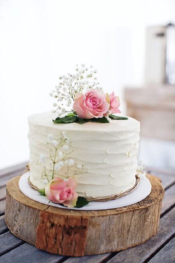 a white cake with pink flowers on top