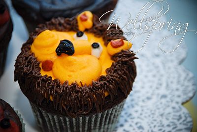 cupcakes with frosting shaped like animals on them