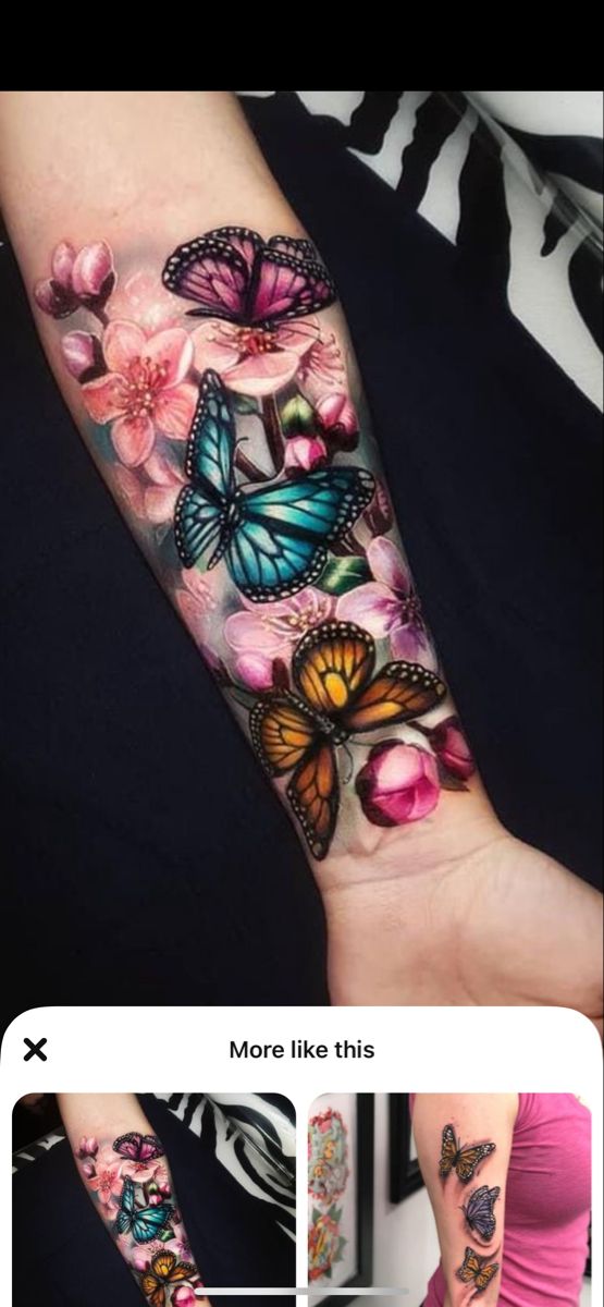 a woman's arm with butterflies and flowers on it