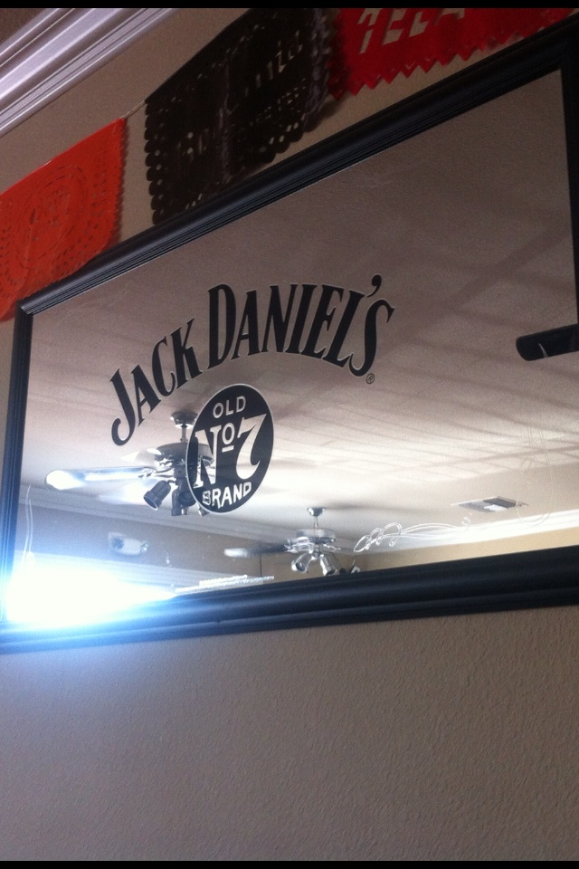 there is a sign on the wall that says jack daniels