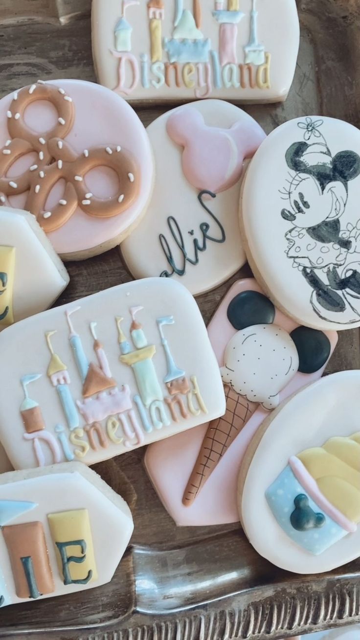 decorated cookies in the shape of disney characters