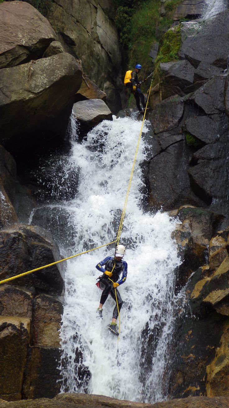 a man is rapping through the water on a rope