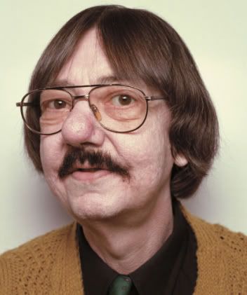 an older man with glasses and a mustache