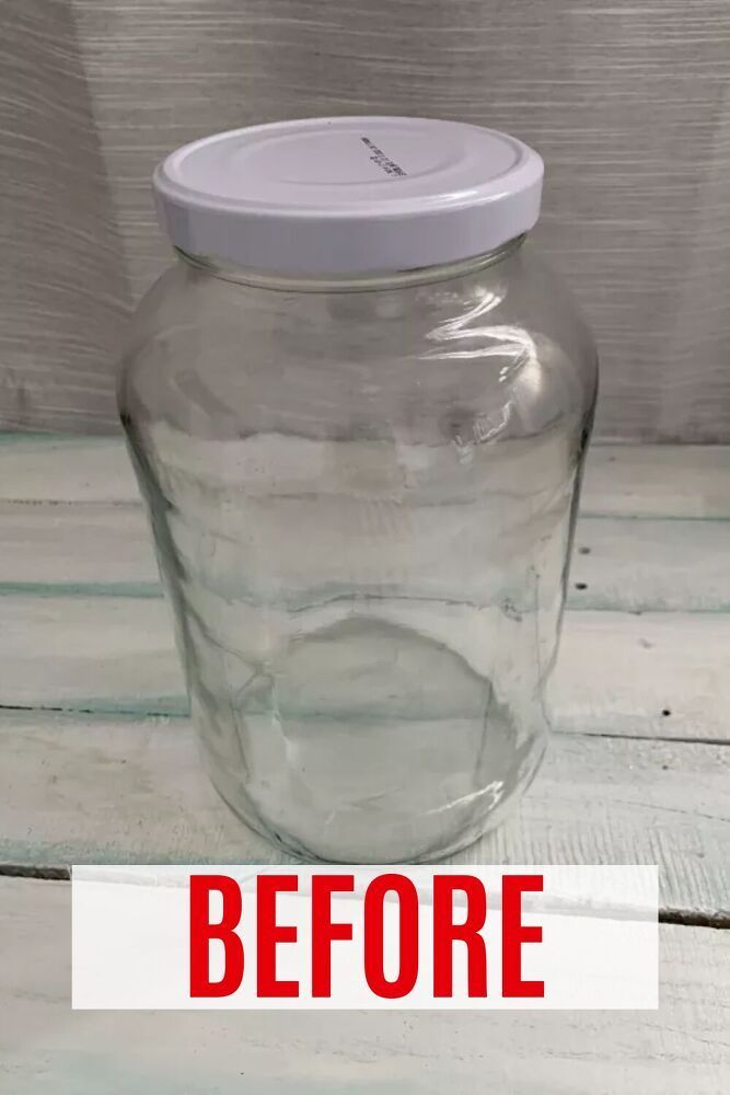 a glass jar with white lid sitting on top of a wooden table next to a sign that says, before