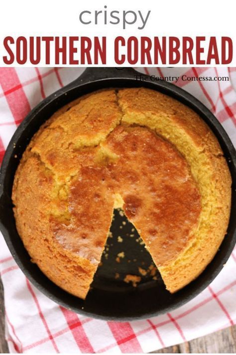 a cornbread in a cast iron skillet on a red and white checkered cloth