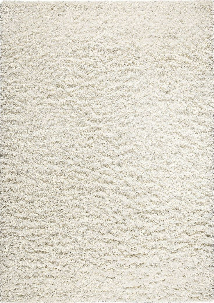 a white area rug with wavy lines on the top and bottom, in varying sizes