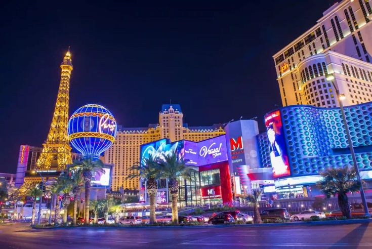 las vegas at night with the eiffel tower in the background