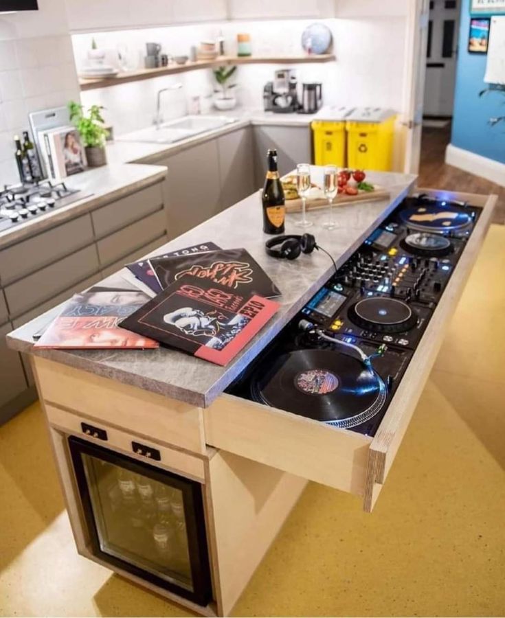 a kitchen with an island that has records on it