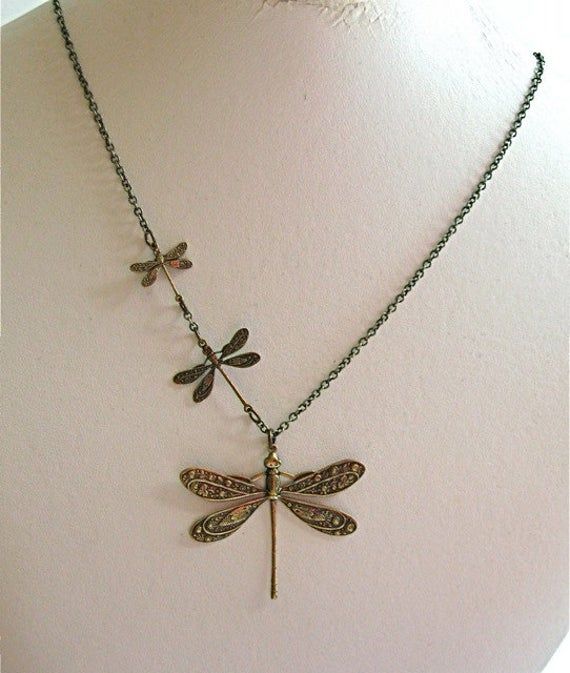 "Brass Dragonfly Necklace - Three Ornate Antiqued Brass Dragonflies in three different sizes, on an Antiqued Brass Chain. The large dragonfly is slightly over 1.5\" high x 2\" wide, the medium dragonfly is just under 1\" high x 1\" wide, and the smallest dragonfly is just under .75\" high x .75\" wide. These are stampings. The design is on one side. 20\" Length This necklace is also available in other metal finishes: http://www.etsy.com/shop/mcstoneworks/search?search_query=triple+dragonfly& Woman Birthday, Dragonfly Gifts, Jewelry Nature, Dragonfly Jewelry, Indie Jewelry, Estilo Hippie, Dragonfly Necklace, Mia 3, Dope Jewelry