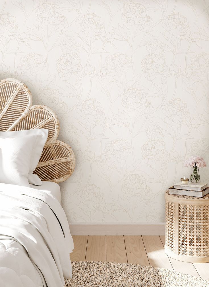 a bedroom with a wicker headboard and white bedding on top of a wooden floor