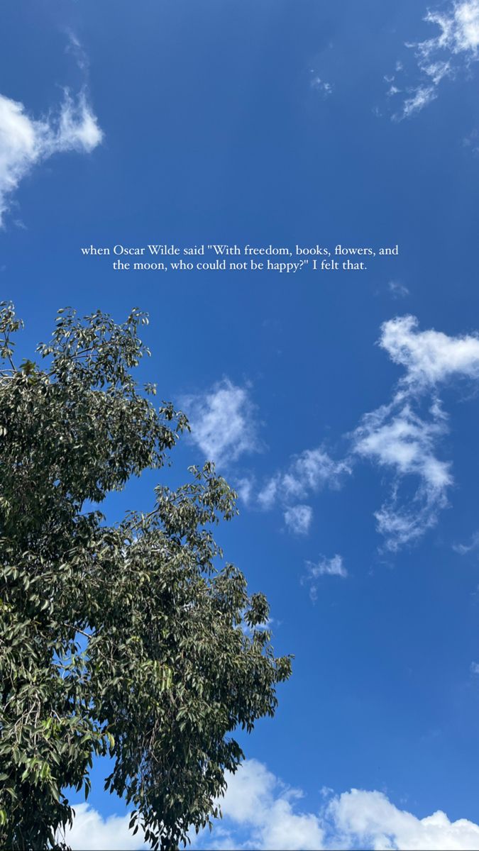 there is a blue sky with white clouds and some trees in the foreground that has a quote on it