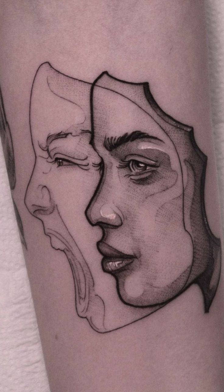 a woman's face with two faces drawn on her leg, in black and white