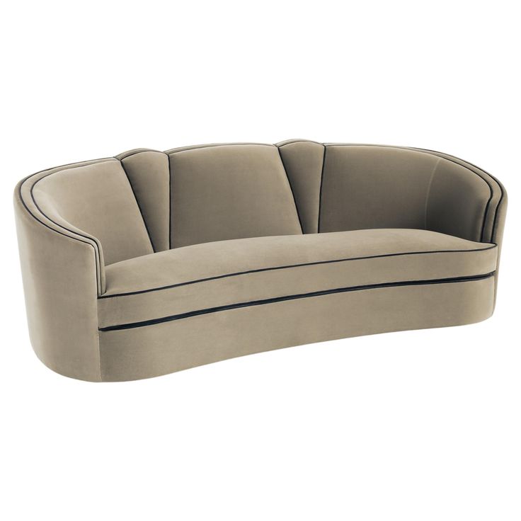 the curved sofa is made from fabric and has black piping on the bottom half