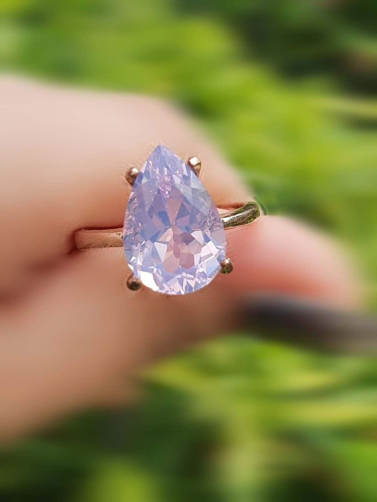 "Pear-Cut natural Lavender Engagement Ring 14k Rose Gold Ring, Natural Gemstone Ring. ------------- This 14k solid rose gold ring is set with a Large pearcut dreamy- hazy Lavender purple Quartz. The 5.53 carats Lavender Quartz has a gorgeous luster a dreamy color. It is a beautiful rare natural gemstone. It is an elegant fine soitaire ring you can not ignore. It will remind you of the soft dreamy part of life we all have :) This ring would make a gorgeous fine jewel gift for a special occasion. Purple Opal Engagement Ring, Lavender Quartz Ring, Solitaire Pear Engagement Ring, Lavender Wedding Ring, Lavender Engagement Ring, Purple Engagement Ring, Lavender Engagement, Lilac Ring, Fantasy Future