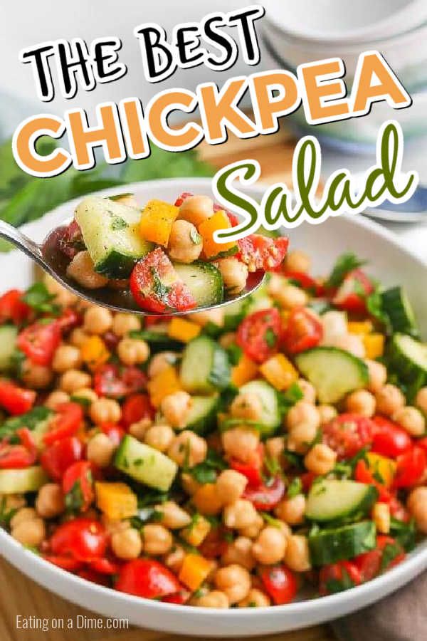 the best chickpea salad in a white bowl with a spoon