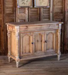 an old wooden cabinet with two pictures on it