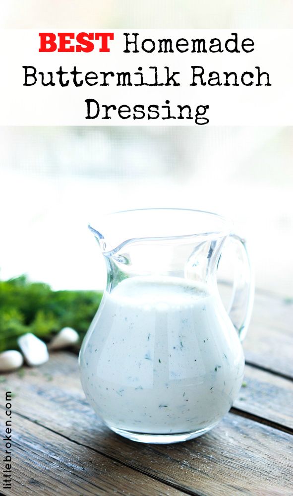 the best homemade buttermilk ranch dressing in a glass pitcher on a wooden table