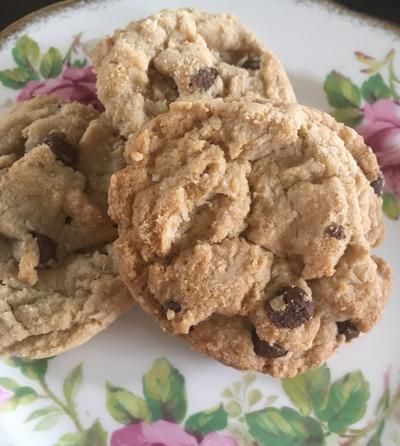 two cookies on a floral plate with pink flowers