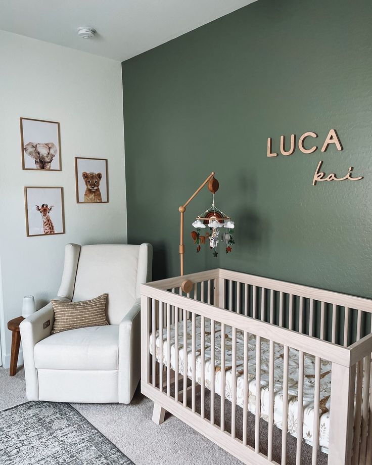 a baby's room with a rocking chair, crib and pictures on the wall