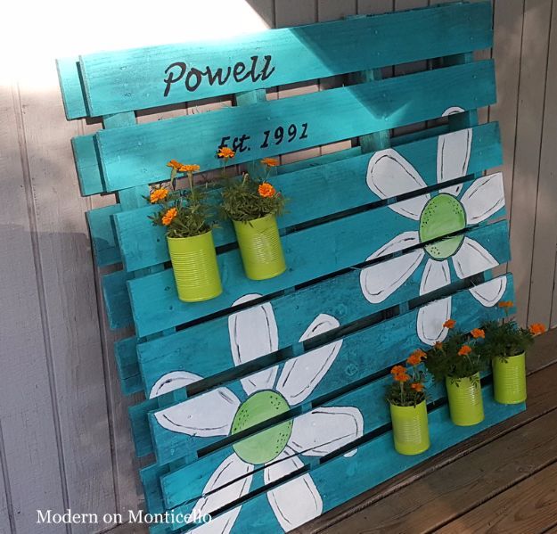 a wooden pallet with flowers painted on it