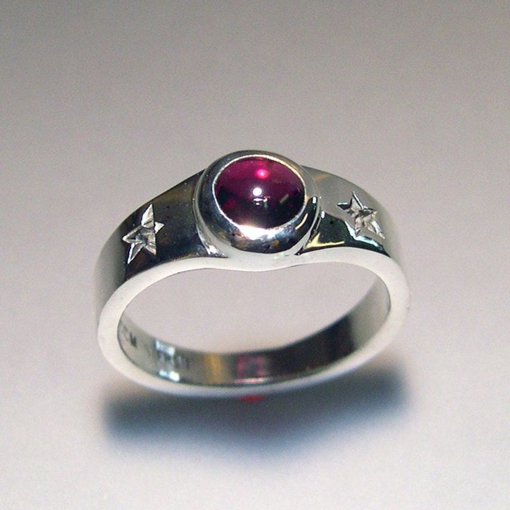 Two special stars, and an almandine garnet cabachon are the focal point on this hand carved, and cast, fun ring! The garnet measures 6mm, and is a beautiful raspberry color. It is bezel set, so there is no need to worry about prongs catching. This ring is sterling silver. This ring is made to order. Thanks for looking! Chris Celestial Ring, Almandine Garnet, Raspberry Color, Dope Jewelry, Garnet Ring, Funky Jewelry, Jewelry Lookbook, Rings Cool, Garnet Rings