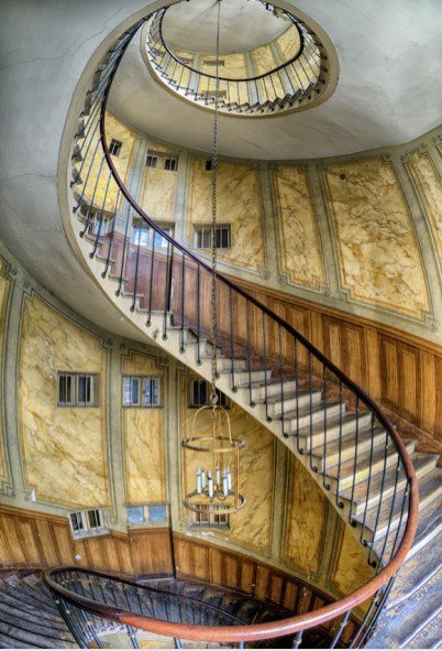 a spiral staircase in an old building