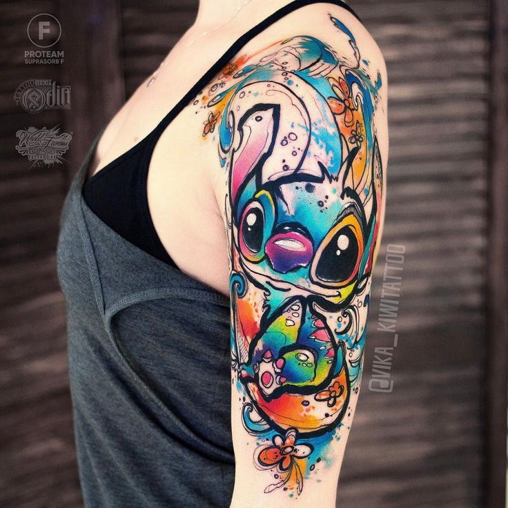 a woman's arm with a colorful tattoo design on the left side of her body