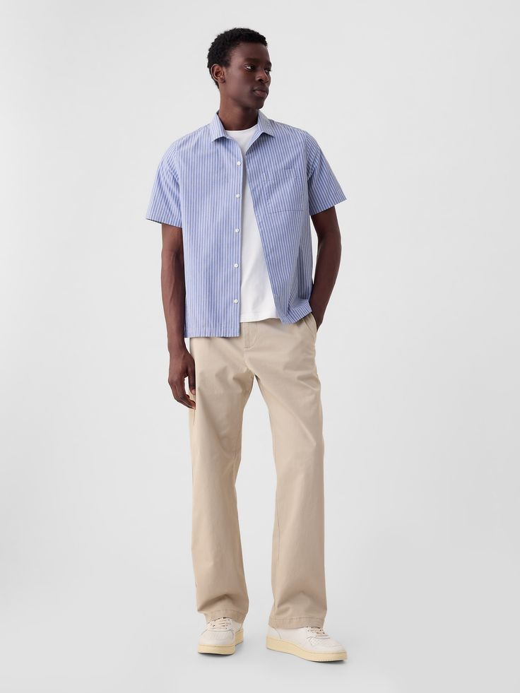 Stretch cotton khaki pants in a baggy fit.  Zip fly.  Classic five-pocket styling.  This pair of khakis is part of our water-saving Washwell program.  Compared to conventional wash methods, Washwell has saved millions of liters of water since 2016.  This product was made in a factory that runs the Gap Inc.  P. A. C. E.  Personal Advancement & Career Enhancement) program.  P. A. C. E.  is our educational program that helps the women who make our clothes build the skills, knowledge, confidence & resilience needed to advance in work & life.  Learn more at gap. com/pace Mid Rise.  Relaxed through the hip and thigh.  Loose straight leg.  Longer inseam puddles at the hem.  Models are 6'1"/185cm–6'2"/188cm with a 31"/79cm waist and 32"/81cm–33"/84cm inseam, and are wearing Gap Men Loose Pants Outfit, Gap Tapered Leg Everyday Pants, Gap Tapered Leg Pants For Everyday, Gap Relaxed Fit Pants With Five Pockets, Gap Cotton Everyday Pants, Everyday Cotton Gap Pants, Everyday Cotton Pants By Gap, Mens Clean Fashion, Gap Relaxed Fit Bottoms With Five Pockets