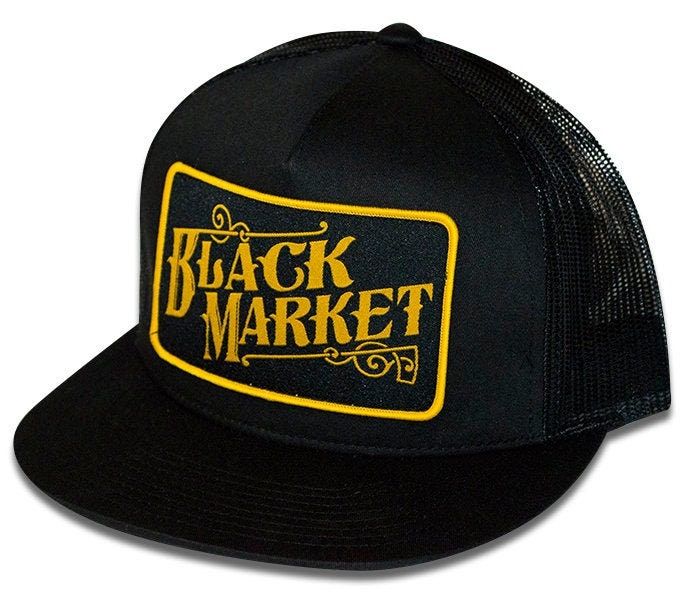 A black trucker hat with a patch sewn on the front. Mad Hat, Market Art, Dope Hats, Black Trucker Hat, Purple Leopard, Black Baseball Cap, Cap Designs, Hat Ideas, Looking Dapper