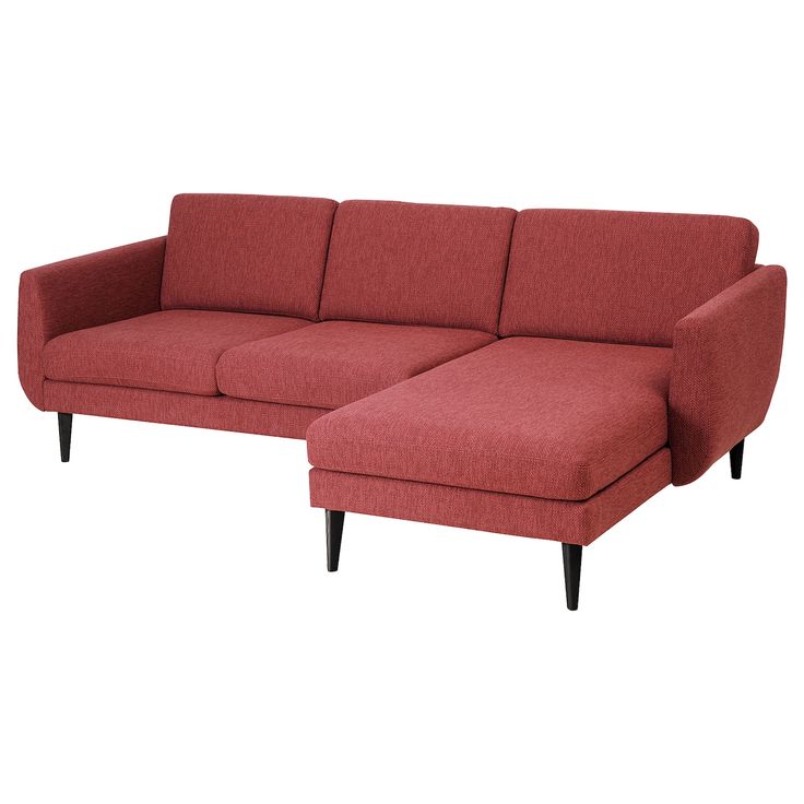 a red sectional sofa sitting on top of a white floor