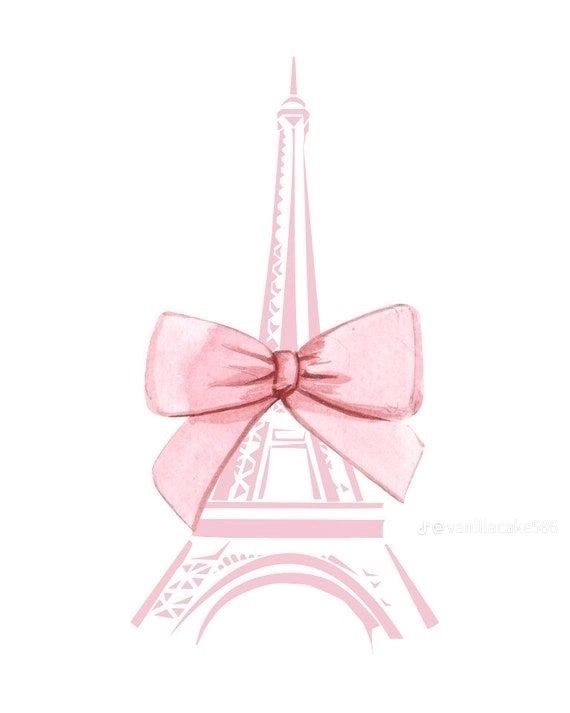 the eiffel tower has a pink bow on it