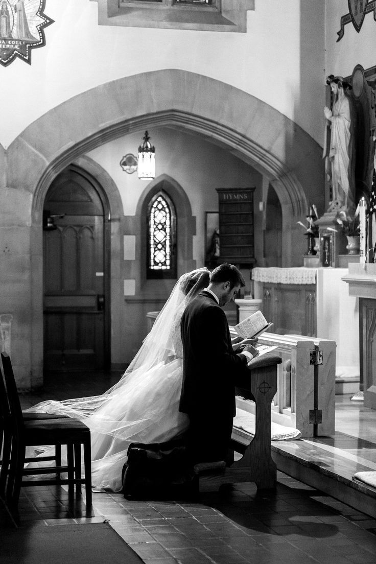 the bride and groom are sitting at the alter