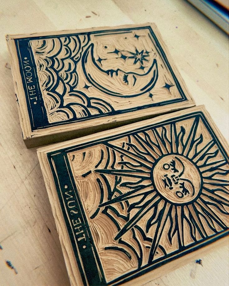 two wooden cards sitting on top of a table