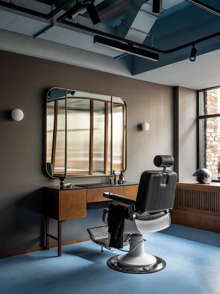 a chair sitting in front of a mirror on top of a blue carpeted floor