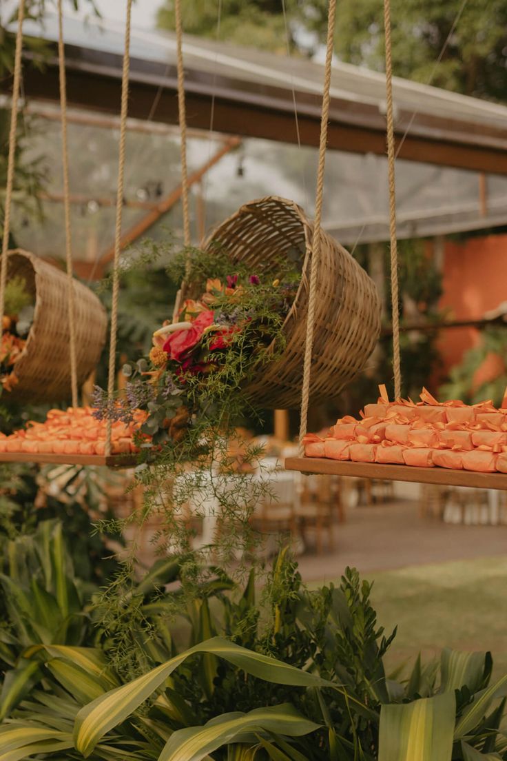 some food hanging from strings in a garden