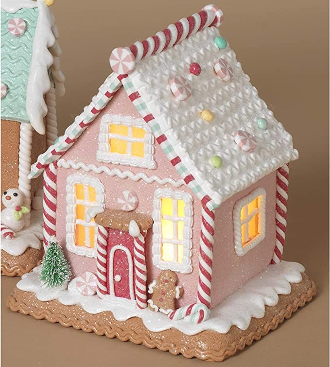 a gingerbread house is decorated with candy canes