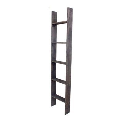 a tall wooden shelf sitting on top of a white wall