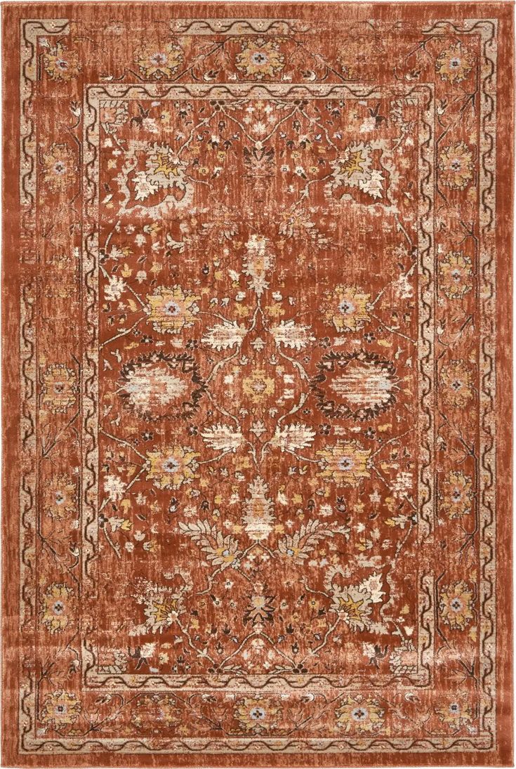 an orange and beige rug with floral designs