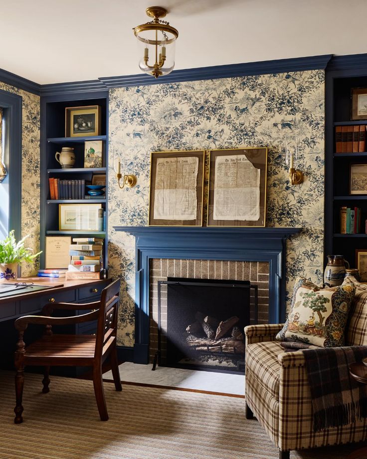 a living room filled with furniture and a fire place in front of a book shelf