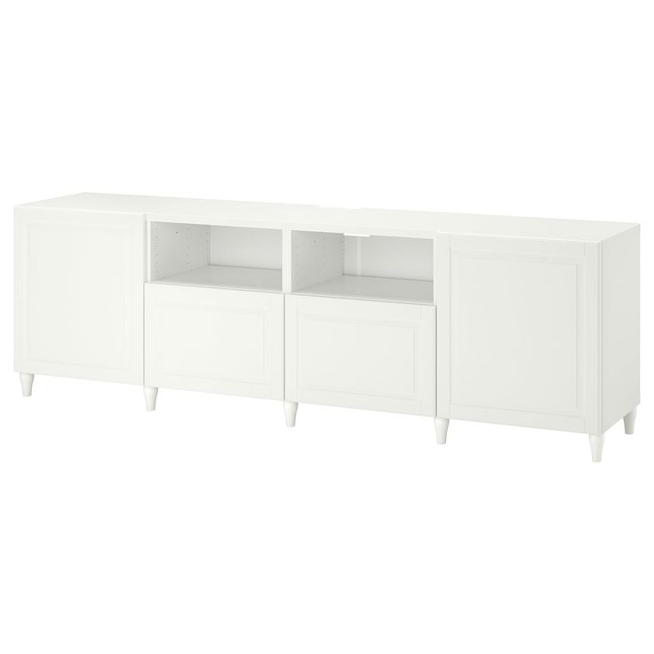 a white cabinet with two doors and three drawers on one side, the other is open